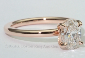 Oval diamond set in 18k rose gold solitaire engagement ring