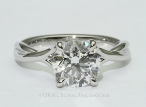 platinum engagement ring diamond solitaire unique twist