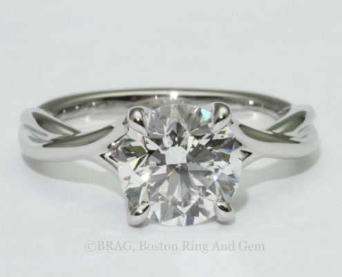 platinum engagement ring diamond solitaire unique twist