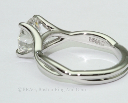 platinum engagement ring diamond solitaire unique twist