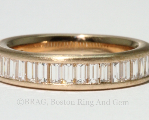 Baguette diamonds set in rose gold channel eternity wedding ring