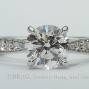 Platinum and diamond Cathedral tapered solitaire with Mill grain edge