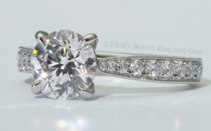 Platinum and diamond Cathedral tapered solitaire with Mill grain edge