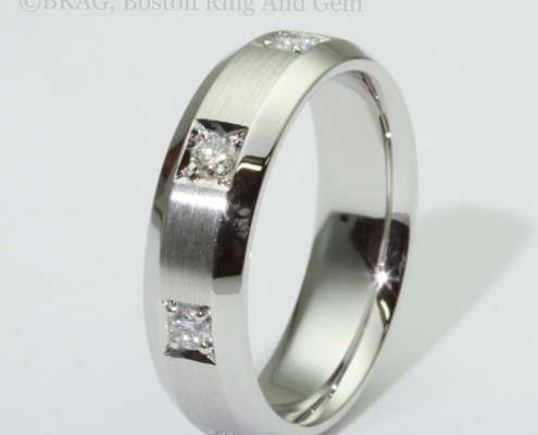 Platinum and diamond inset bevel edge men's wedding ring