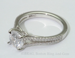 Round platinum halo with 18k rose gold scroll filigree under bezel