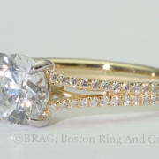 Round platinum halo with 18k rose gold scroll filigree under bezel
