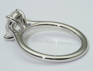 Oval cut diamond set in thin platinum cathedral Solitaire Engagement Ring