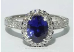 Oval sapphire and diamond platinum halo vintage detailed ring