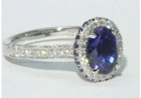 Oval sapphire and diamond platinum halo vintage detailed ring