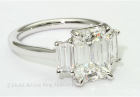 Emerald cut diamond three stone platinum engagement ring