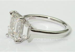 Emerald cut diamond three stone platinum engagement ring