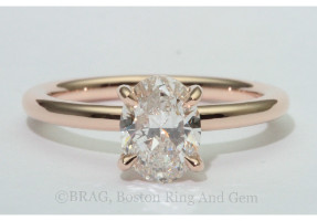 Oval diamond set in 18k rose gold solitaire engagement ring