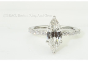 Marquise cut diamond set in a platinum custom 6 prong, none cathedral French cut set diamond solitaire.