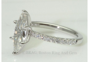 Marquise cut diamond set in a platinum custom 6 prong, none cathedral French cut set diamond solitaire.