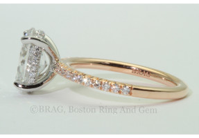 Oval Diamond set in diamond set platinum basket and 18k rose gold French cut set solitaire engagement ring