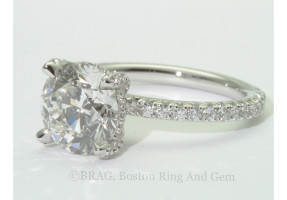 Platinum and diamond solitaire with diamond set prongs, basket and band