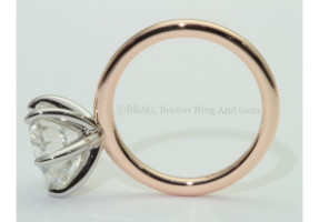 4 carat Round brilliant cut diamond set in a custom curved platinum 6 wire solitaire on an 18k rose gold thin band.