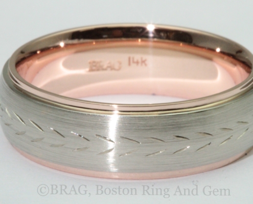 Two tone 14k white and rose gold wedding ring with hand carved pattern.