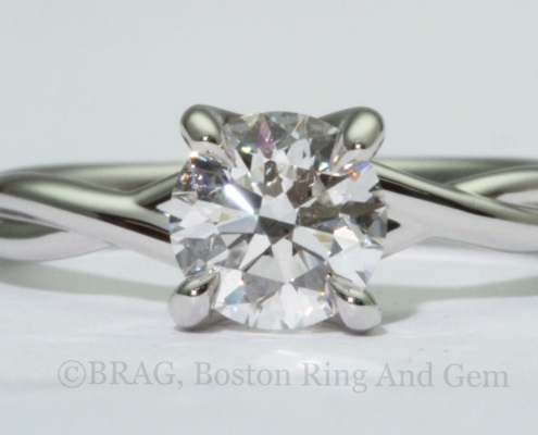 Platinum twist engagement ring with crisscross 4 prongs