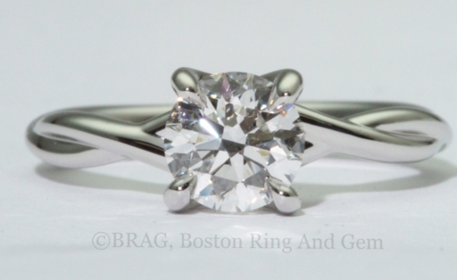 Platinum twist engagement ring with crisscross 4 prongs