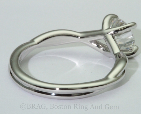 Platinum twist engagement ring with crisscross 4 prongs