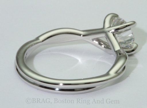 Platinum twist engagement ring with crisscross 4 prongs