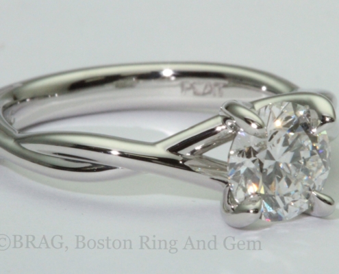 Platinum twist engagement ring with crisscross 4 prongs
