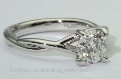 Platinum twist engagement ring with crisscross 4 prongs