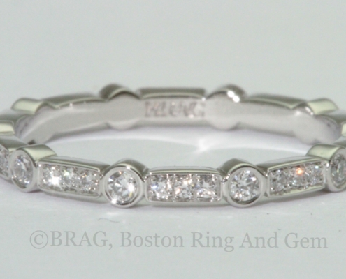 Platinum Art deco wedding ring. Diamonds set in alternating round bezel and rectangle bead set.