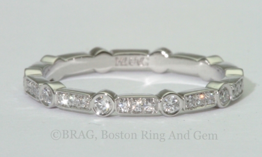 Platinum Art deco wedding ring. Diamonds set in alternating round bezel and rectangle bead set.