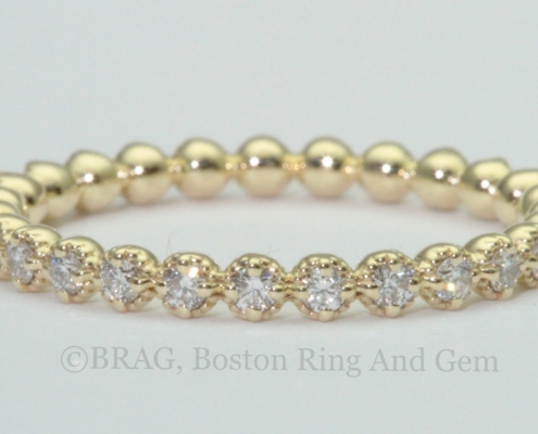 18k yellow gold beaded bezel eternity wedding band