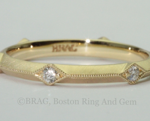 Art deco inspired 18k yellow gold wedding rings with knife edge and diamond accents