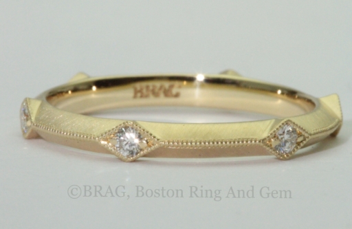 Art deco inspired 18k yellow gold wedding rings with knife edge and diamond accents
