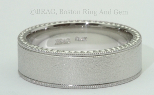 Platinum Men’s wedding ring: 7mm wide flat with mill grain edge and carved sidewalls and band blast finish